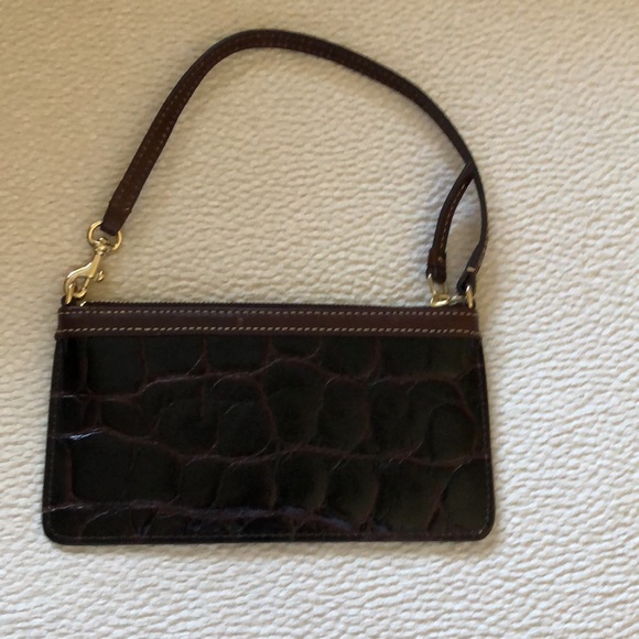 Beautiful brownish burgundy patent leather Dooney Bourke purse with handle. - Picture 2 of 3